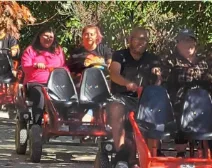 The Lead On group enjoying a ride at Vala's Pumpkin Patch, with members smiling as they experience a scenic fall adventure.